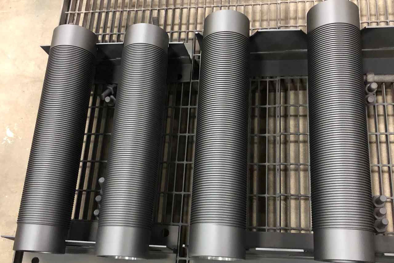 A picture showing rods coated in fluoropolymer coating in a warehouse.