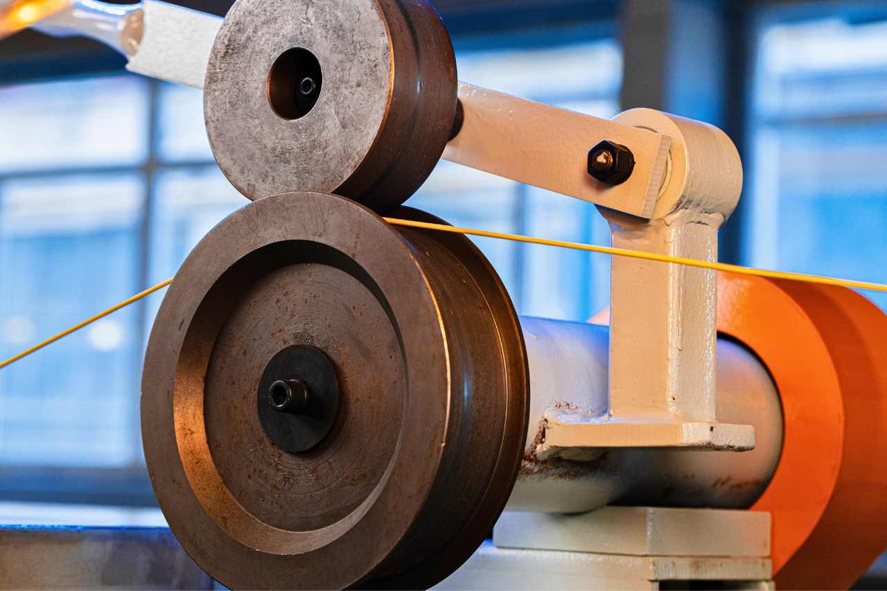 A gear set-up in an industrial machine showing two spinning gears that rub against each other.