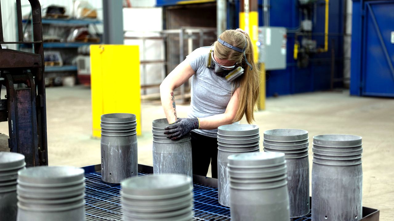 IPC worker preparing valve for protective coatings